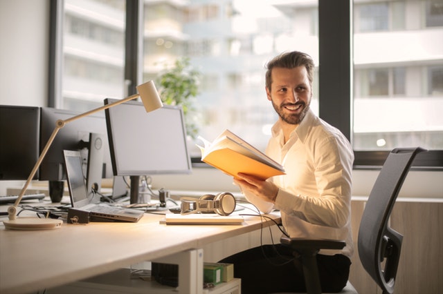 happy worker following a workstation ergonomic assessment