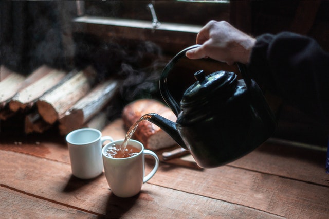 photo-of-person-pouring-hot-beverage-on-mug-3619784